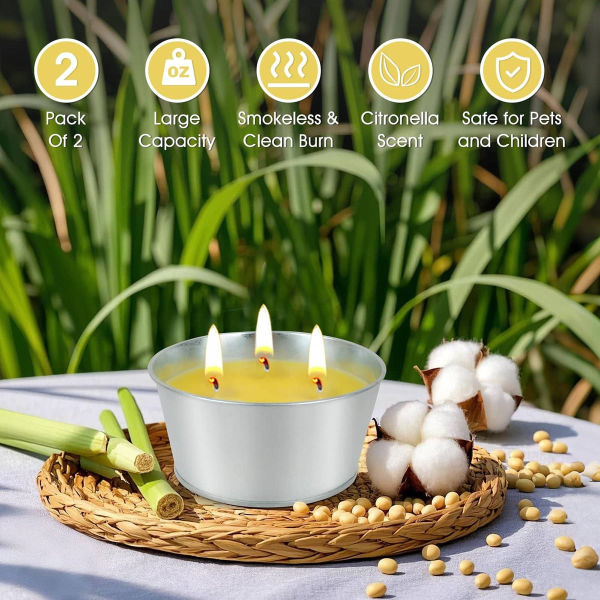 Two large citronella candles in silver metal tins, yellow wax and lit wicks