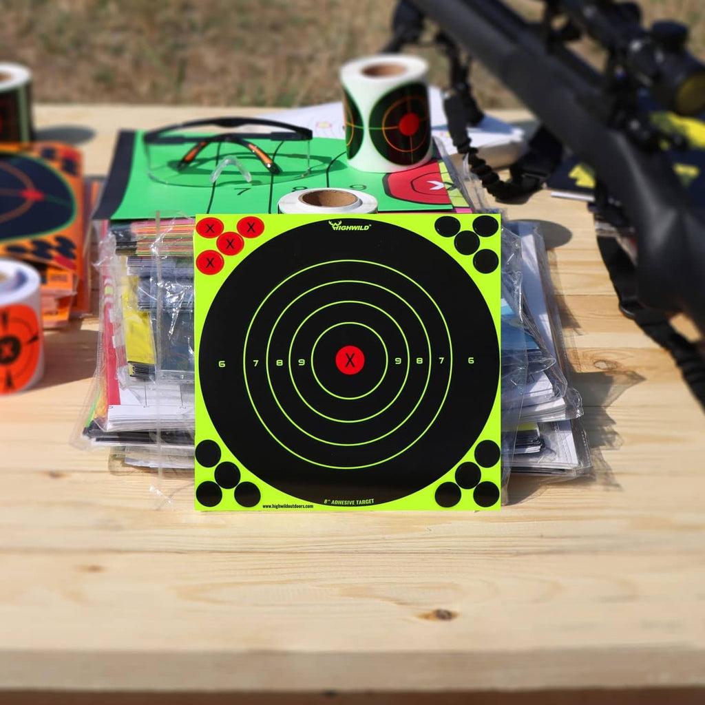 Fluorescent yellow adhesive bullseye target sheet with neon rings and red X, in packaging