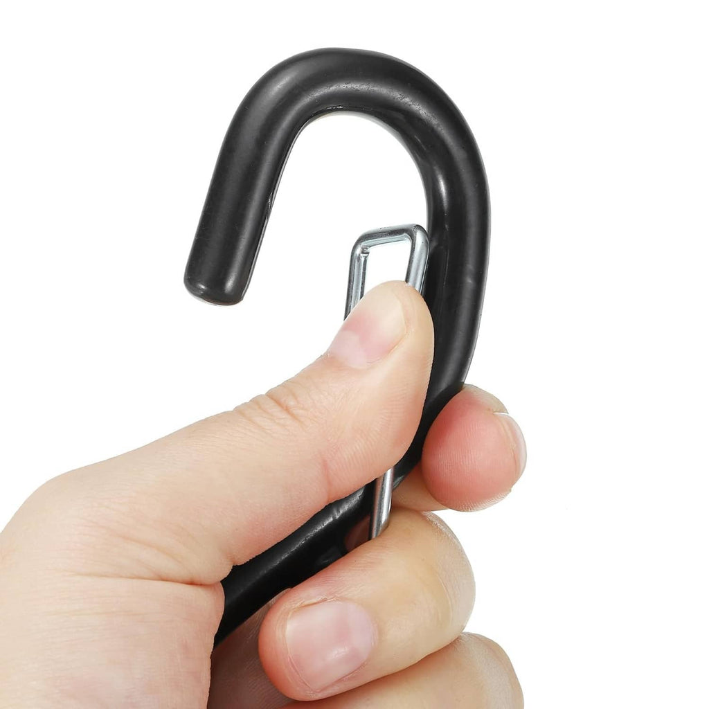 Black rubber S hook latch with silver pin, shown held by hand for connection