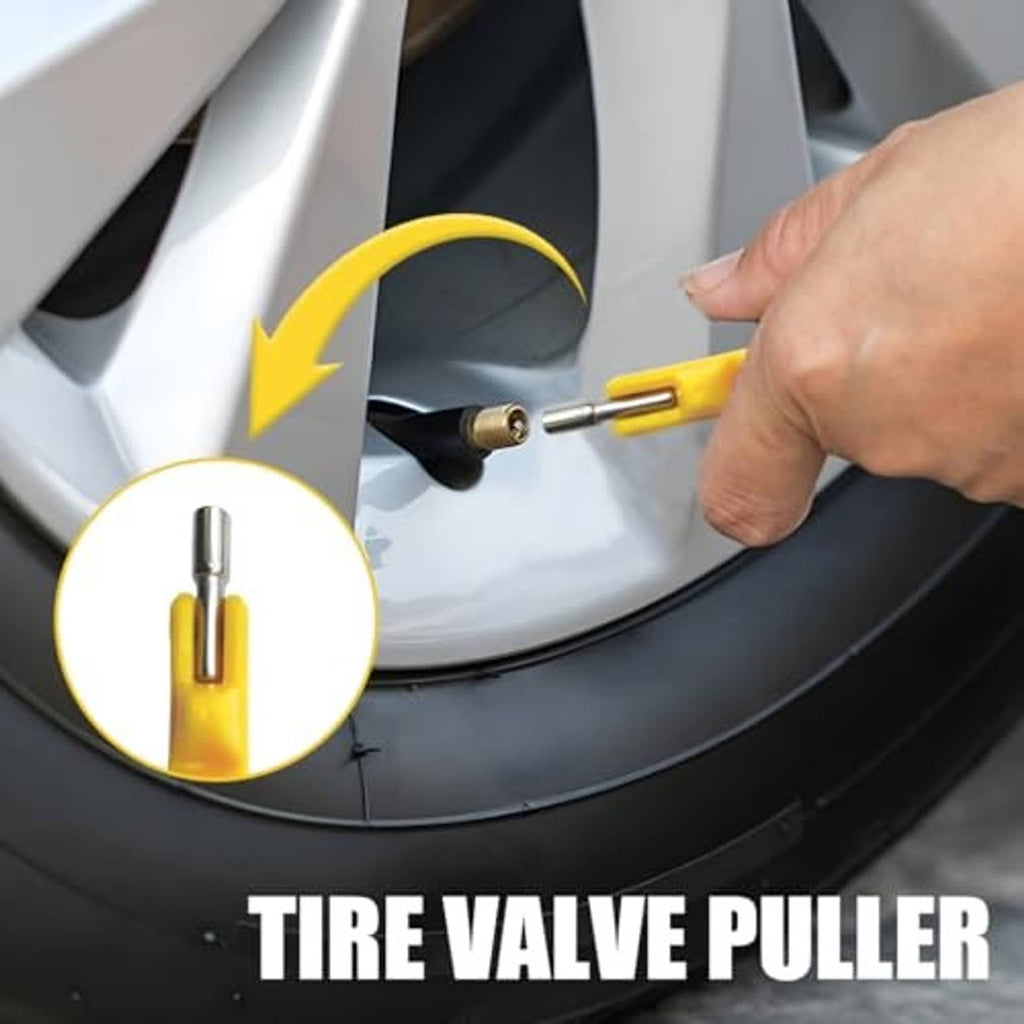 Yellow valve stem puller tool with metal tip inserted near wheel valve