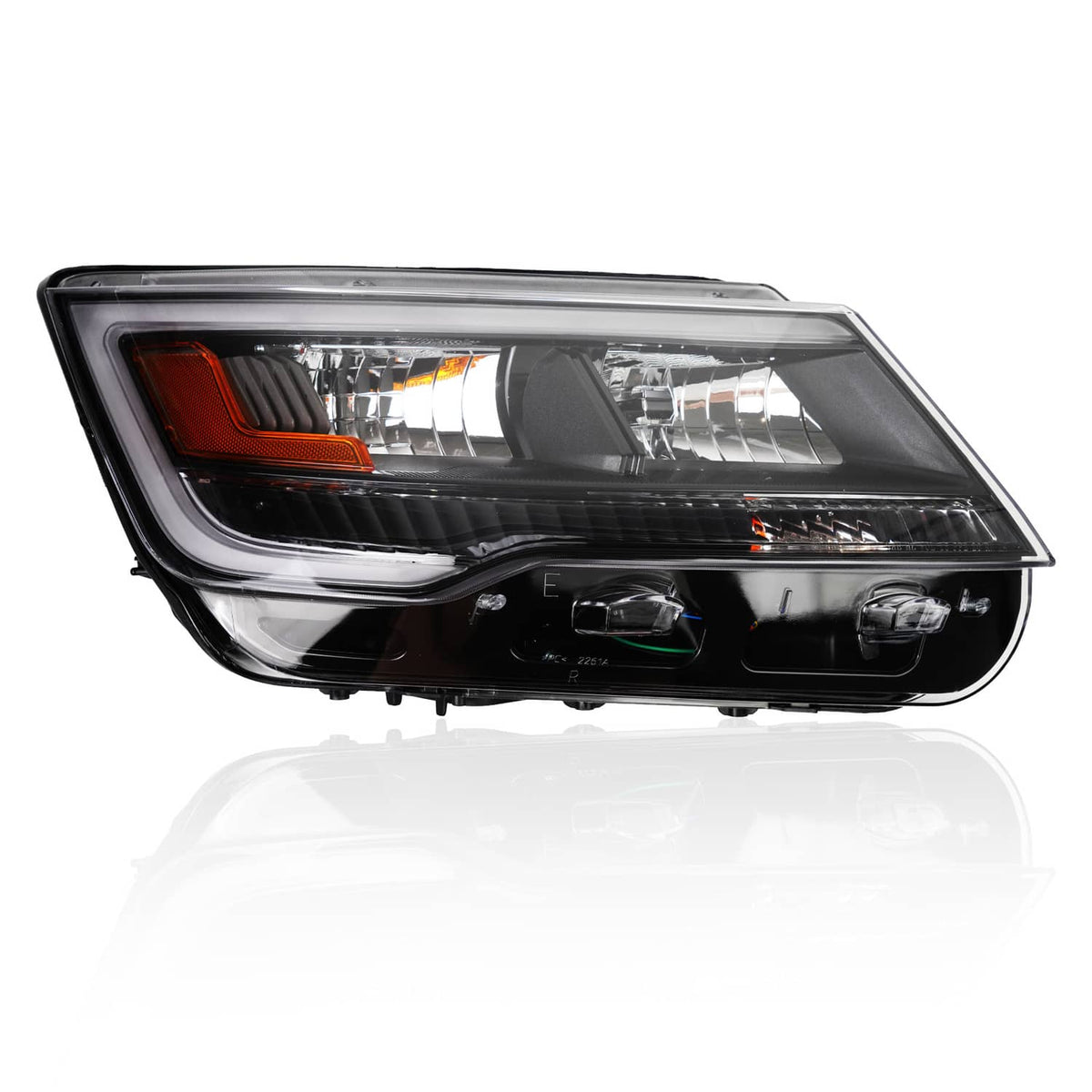 Black headlight assembly with clear lens, chrome reflector strip, and amber corner light