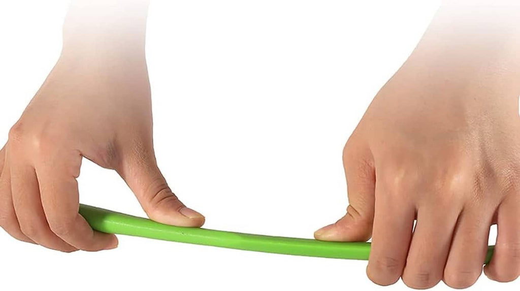 Green silicone spatula held by two hands, smooth flexible scraper edge