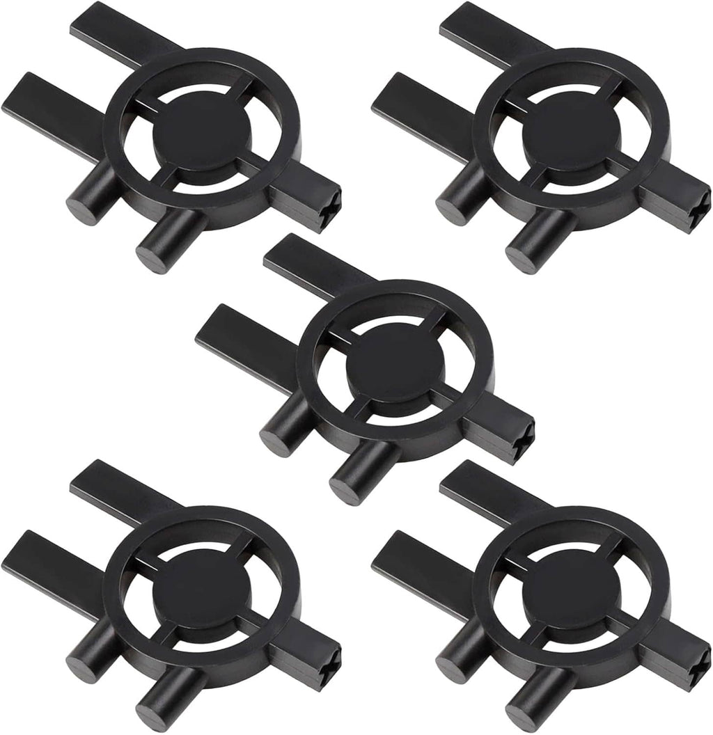 Set of five black plastic dispenser keys with circular key centers