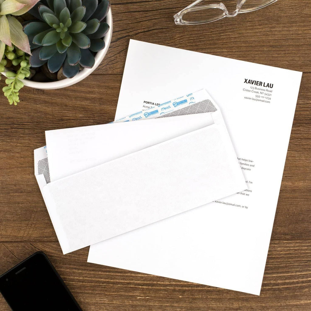 White security envelopes with self-seal flap, multiple envelopes shown