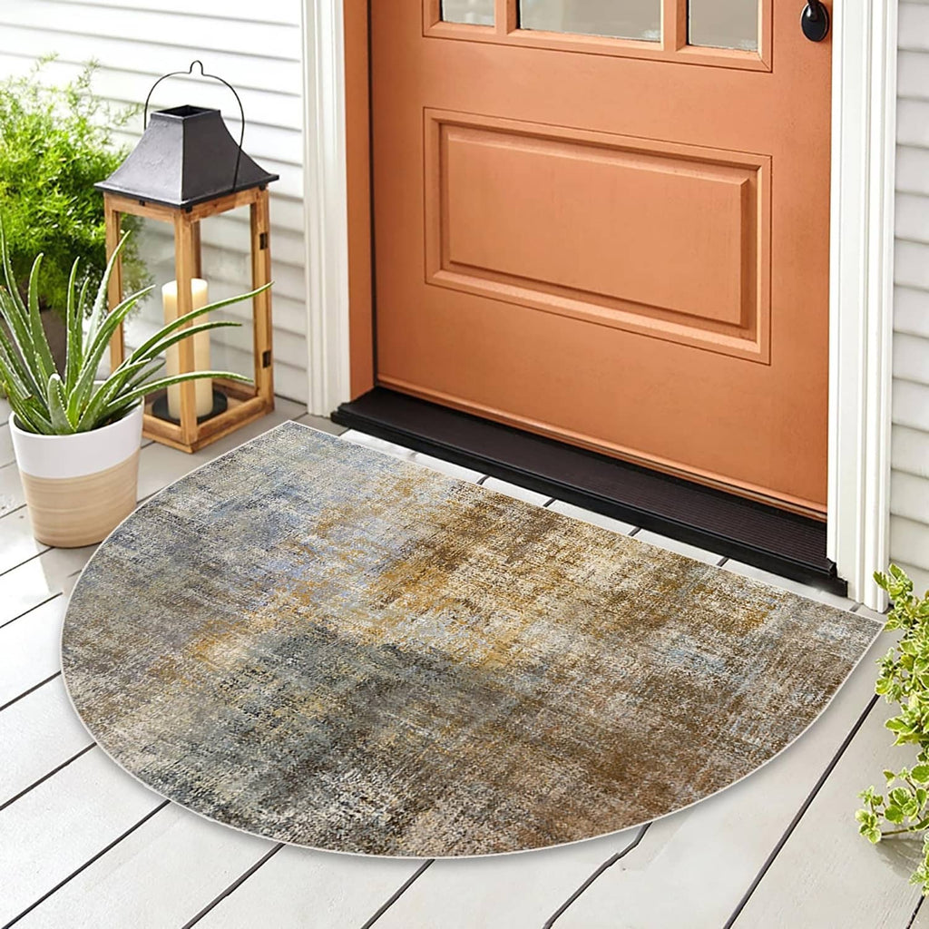 Semicircular woven doormat with mottled blue-gray and tan surface