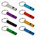 Multicolor aluminum signal whistle keychains with metal rings, multiple whistles shown