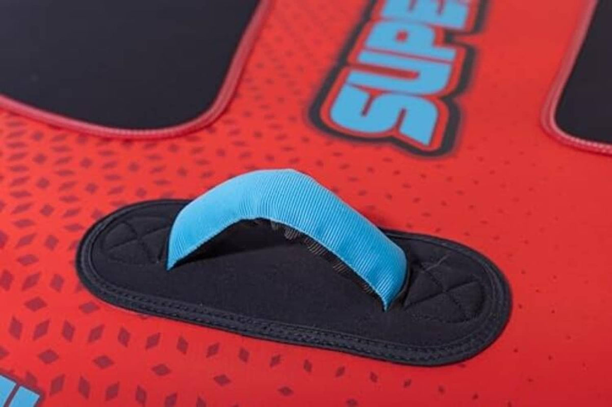 Red towable tube with black foot strap pad and blue reinforced grip