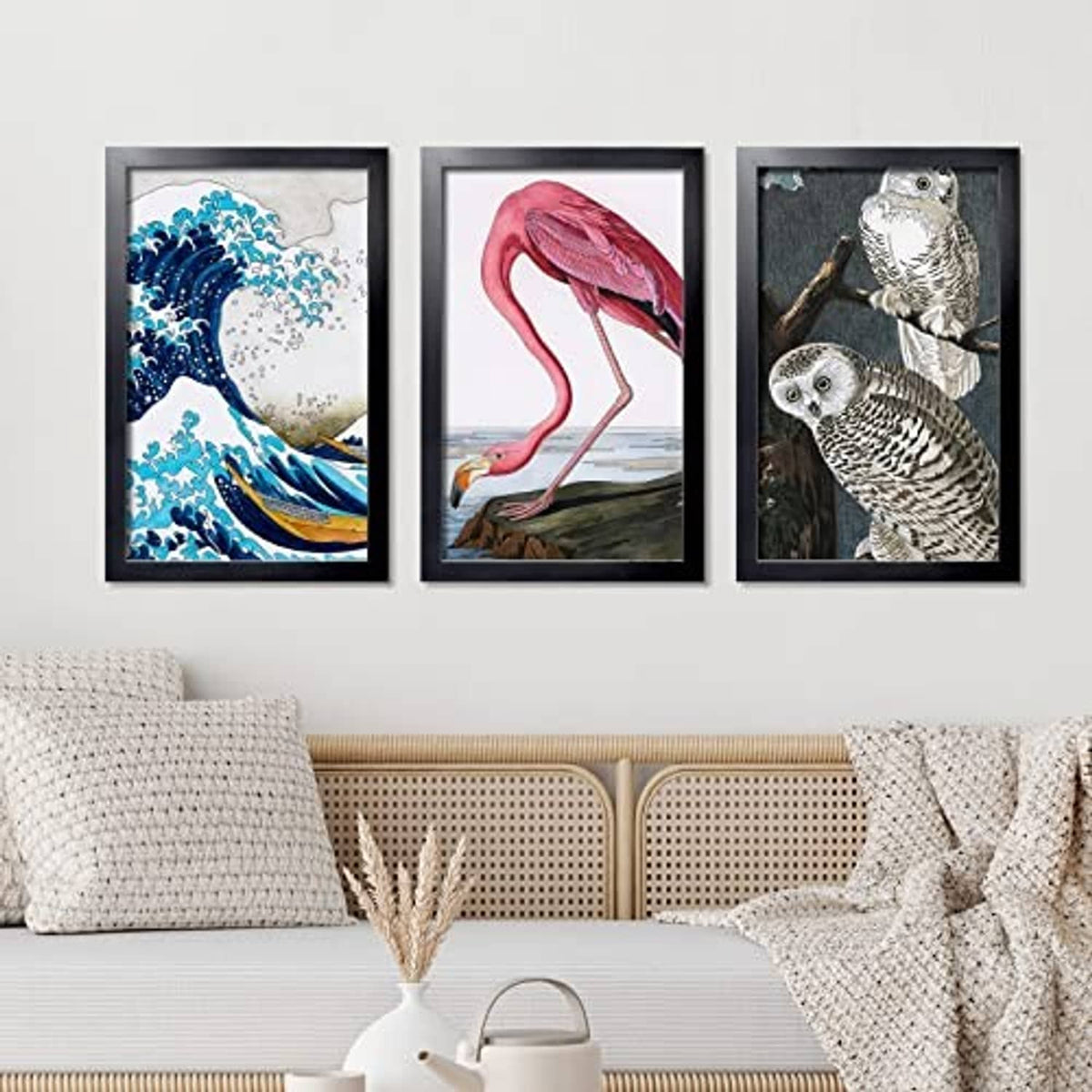 Set of three black picture frames with blue, red, and owl artwork