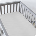 Crib fitted sheet, cloud grey microfiber with snug elastic corners on mattress