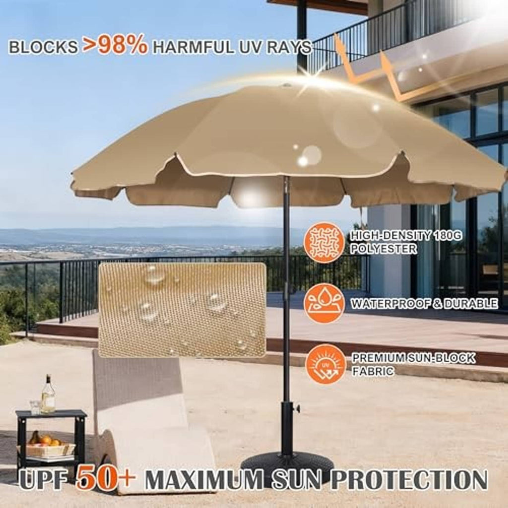 Tan patio umbrella open over outdoor seating with black center pole