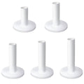 Set of white rubber golf tees with round bases for driving range mats