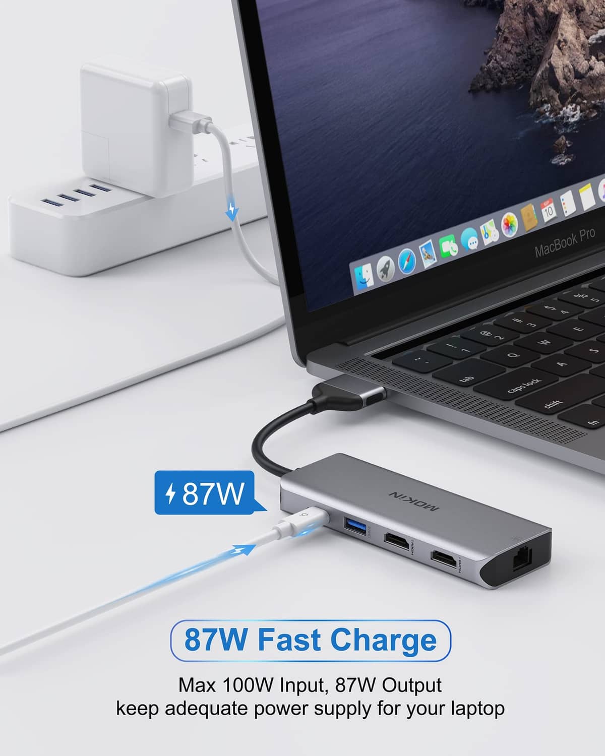 Grey USB-C docking station connected to MacBook, with 87W fast charging