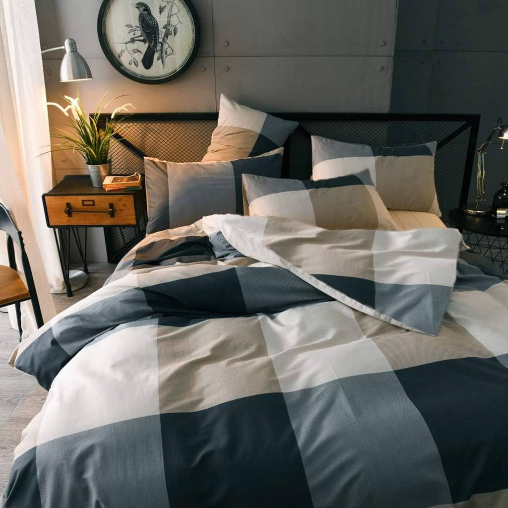 Comforter set with navy and white oversized check pattern and multiple pillow shams