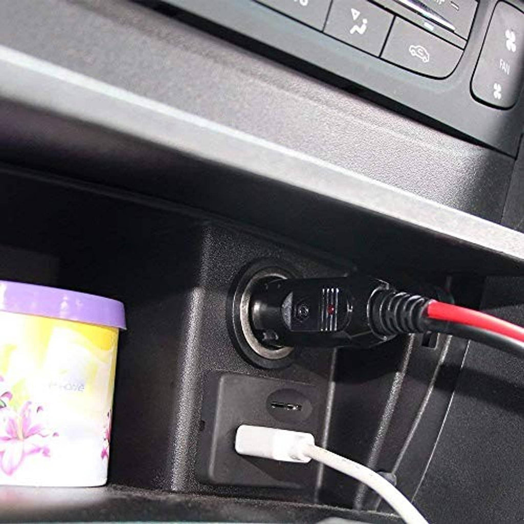 12V fused car cigarette lighter plug inserted into vehicle socket with red/black leads