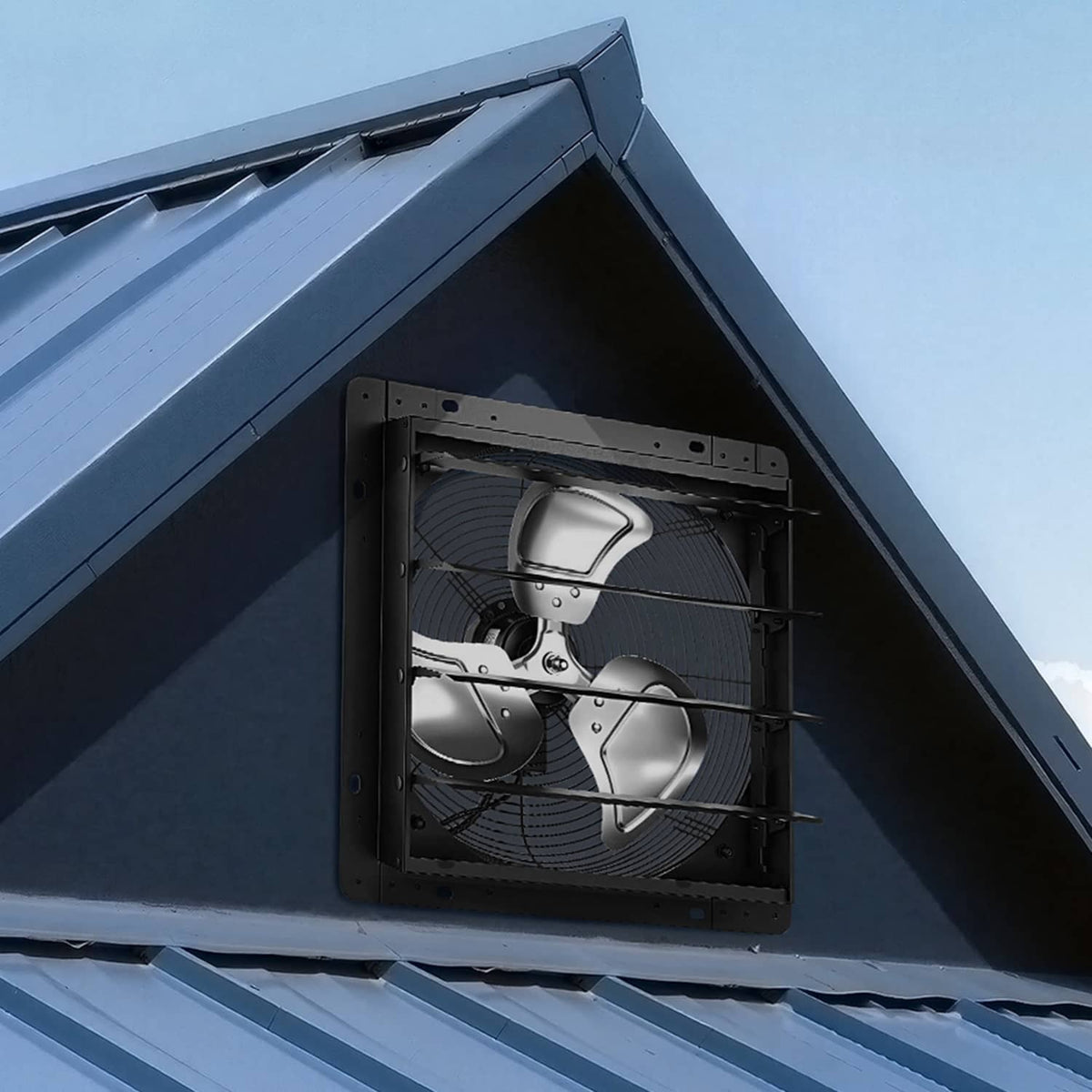 14-inch wall-mount exhaust fan installed in an exterior wall opening