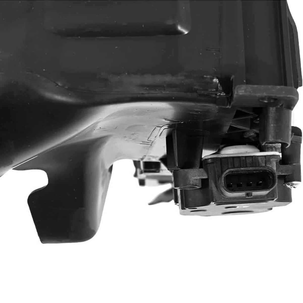 Close-up of black grille shutter actuator connector with wiring plug and mounting housing