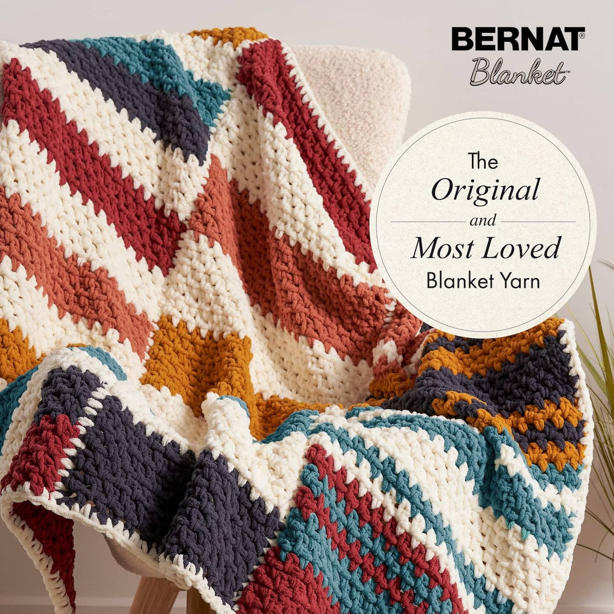 Multi-color striped crochet blanket with bold blocks and plush texture
