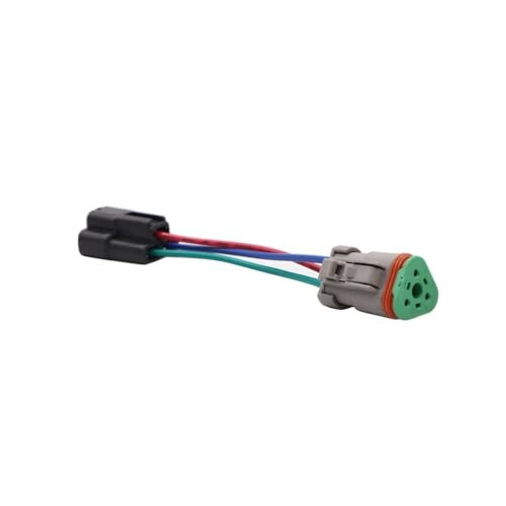 Connector pair: black plug and green multi-pin connector on the trimmed wire harness