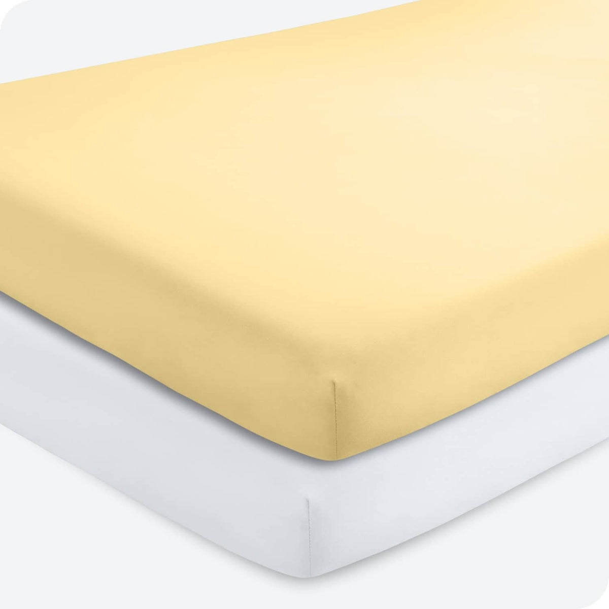 Yellow crib fitted sheet with fitted corners and elastic trim