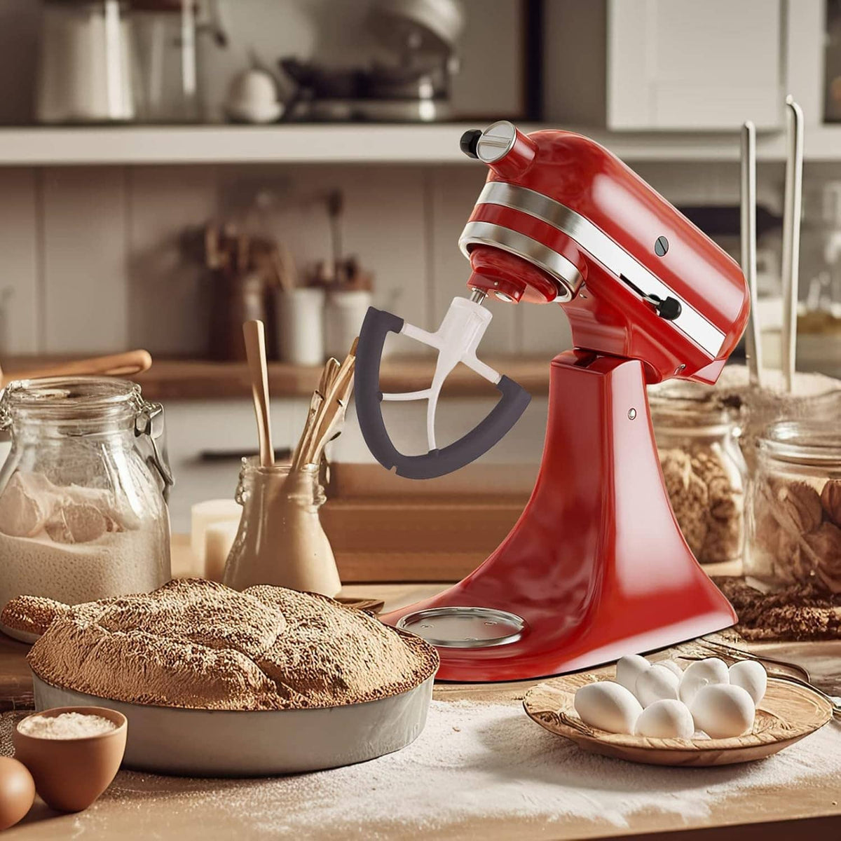 Beater paddle attachment on a stand mixer, showing white arms and dark gray edge