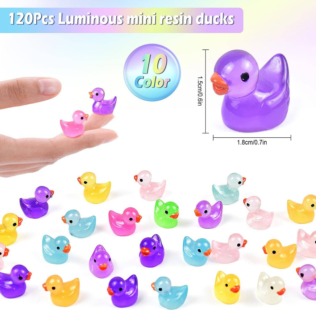 Purple luminous resin duck figurine held between fingers, with more ducks below