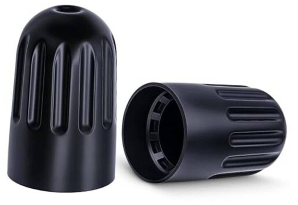 Black TPMS long-stem tire valve caps with ribbed side vents, two-piece close-up