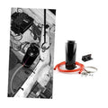 Black radiator coolant overflow bottle with red hose, clamps, and mounting bracket