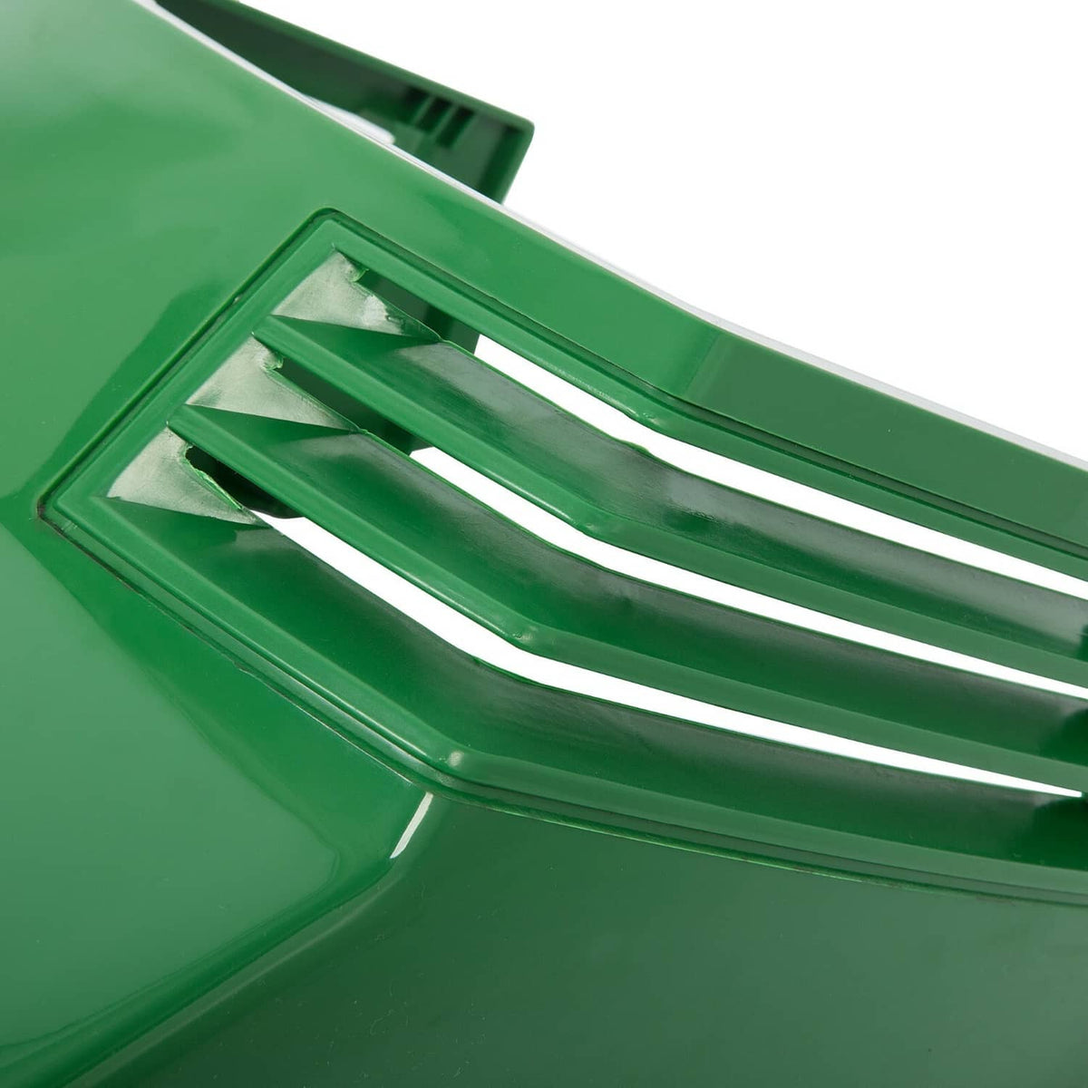 Close-up of green vented grille on hood assembly with parallel slats.