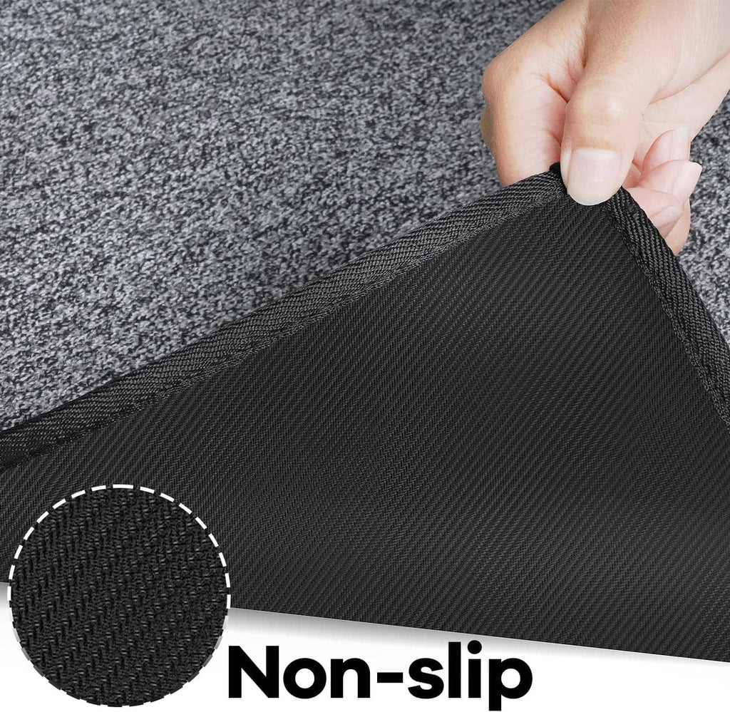 Charcoal gray runner rug corner lifted to show ribbed non-slip backing underside