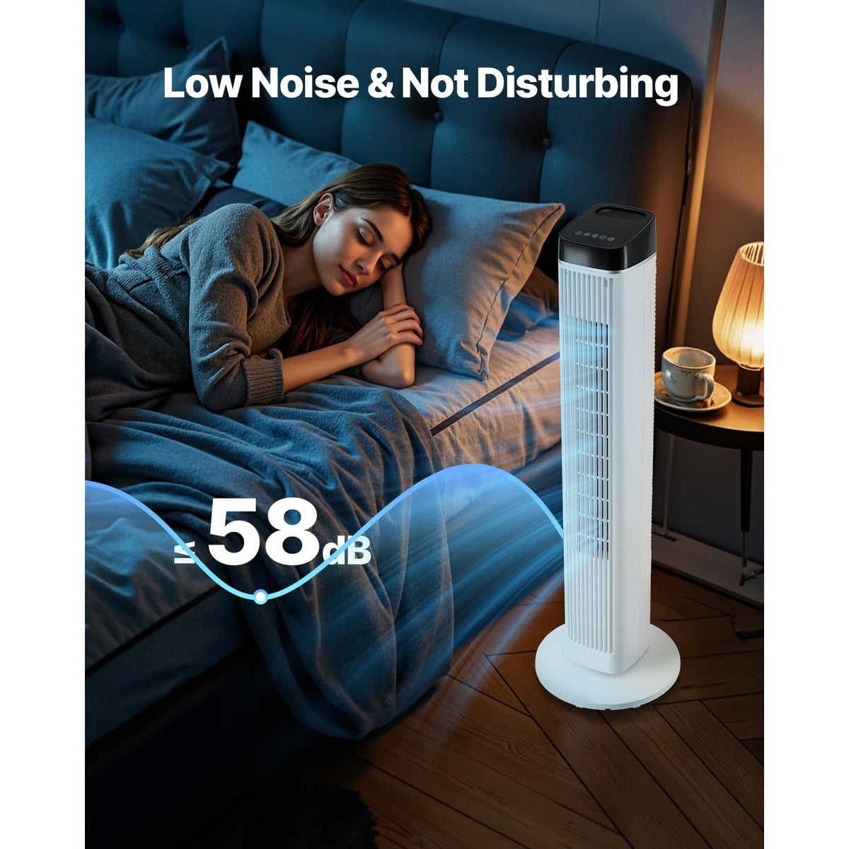 White tower fan standing on the floor next to a bed in a living room setting