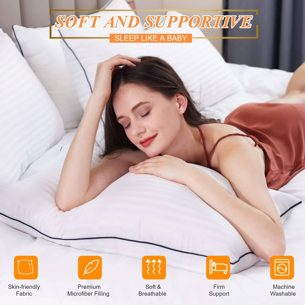 White sleeping pillows with blue piping, used while lying in bed