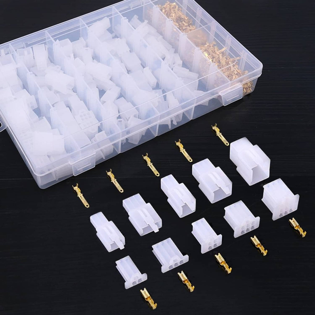 Clear plastic parts box with white connector housings and gold crimp terminals