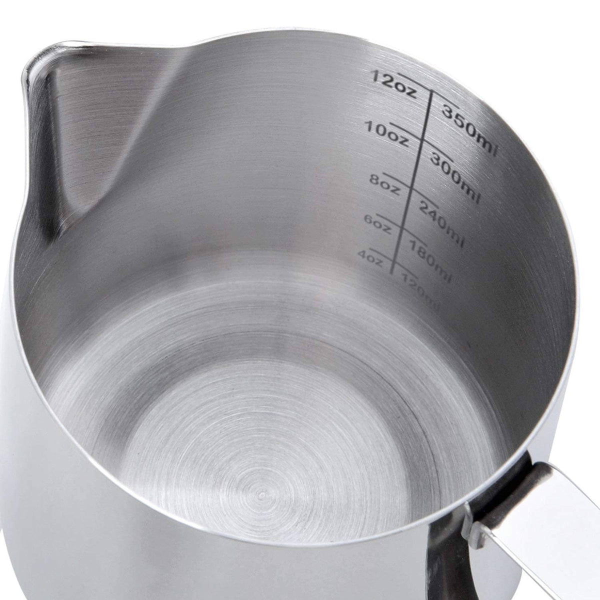 Stainless steel frothing pitcher interior with circular base and measurement markings