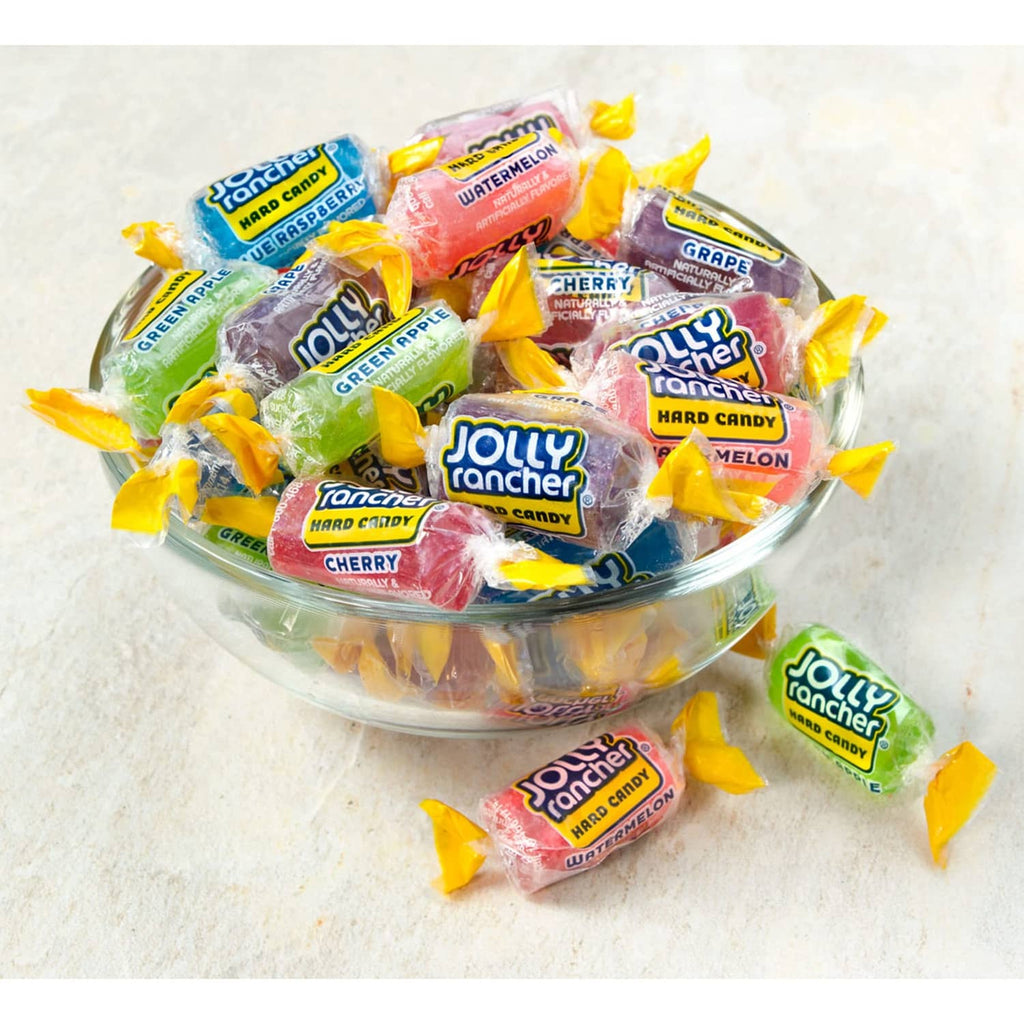 JOLLY RANCHER assorted fruit hard candies in a clear bowl with wrappers