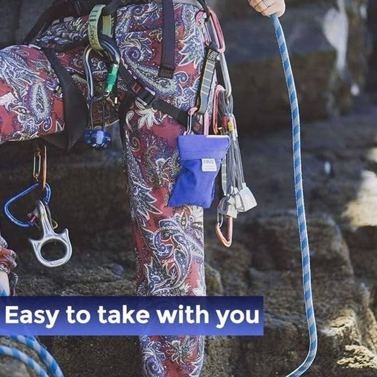 Small blue FRIO cooling wallet hanging from a bag for insulin and syringe storage