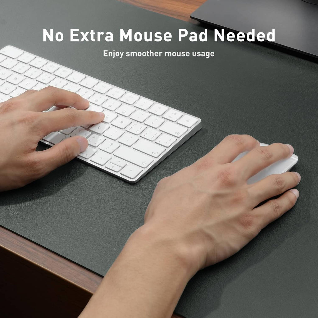 Jungle green leather desk pad protector with hands using keyboard and mouse