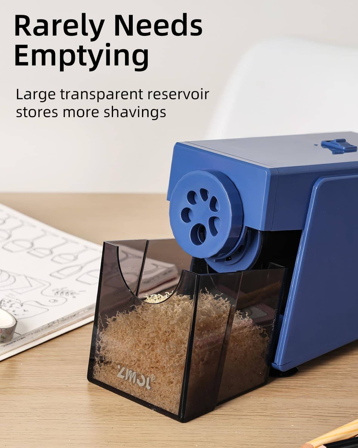 Blue electric pencil sharpener with clear shavings reservoir and cutting slot