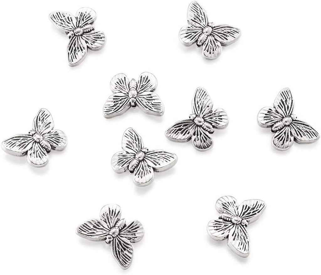 Antique silver butterfly spacer beads set, featuring circular center details and ridged wings