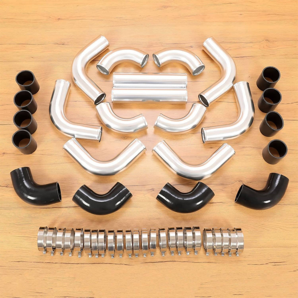 Intercooler piping kit with silver aluminum elbows, black couplers, and metal clamps