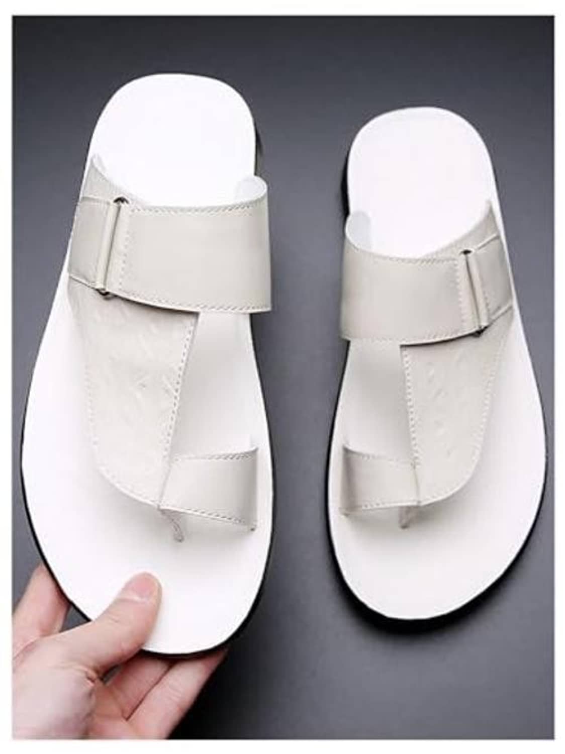 White thong sandals with wide front strap and open toe, flat textured sole