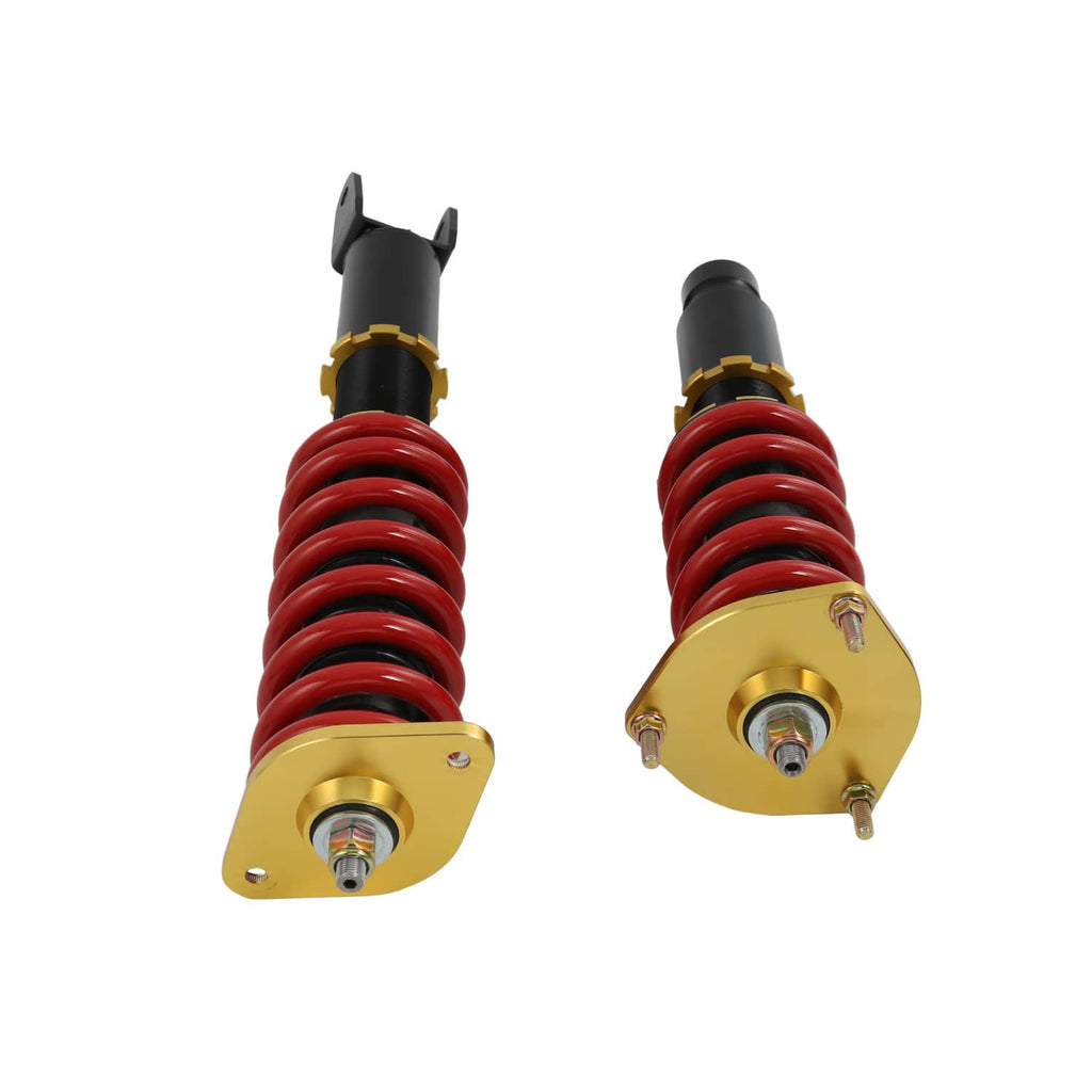 Close view of coilover tops: red springs, black housings, gold plates and adjustment bolts