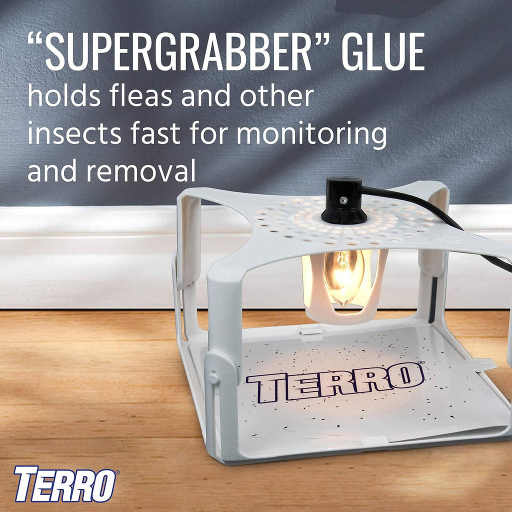 White TERRO flea trap glue board on base; Supergrabber glue for insects