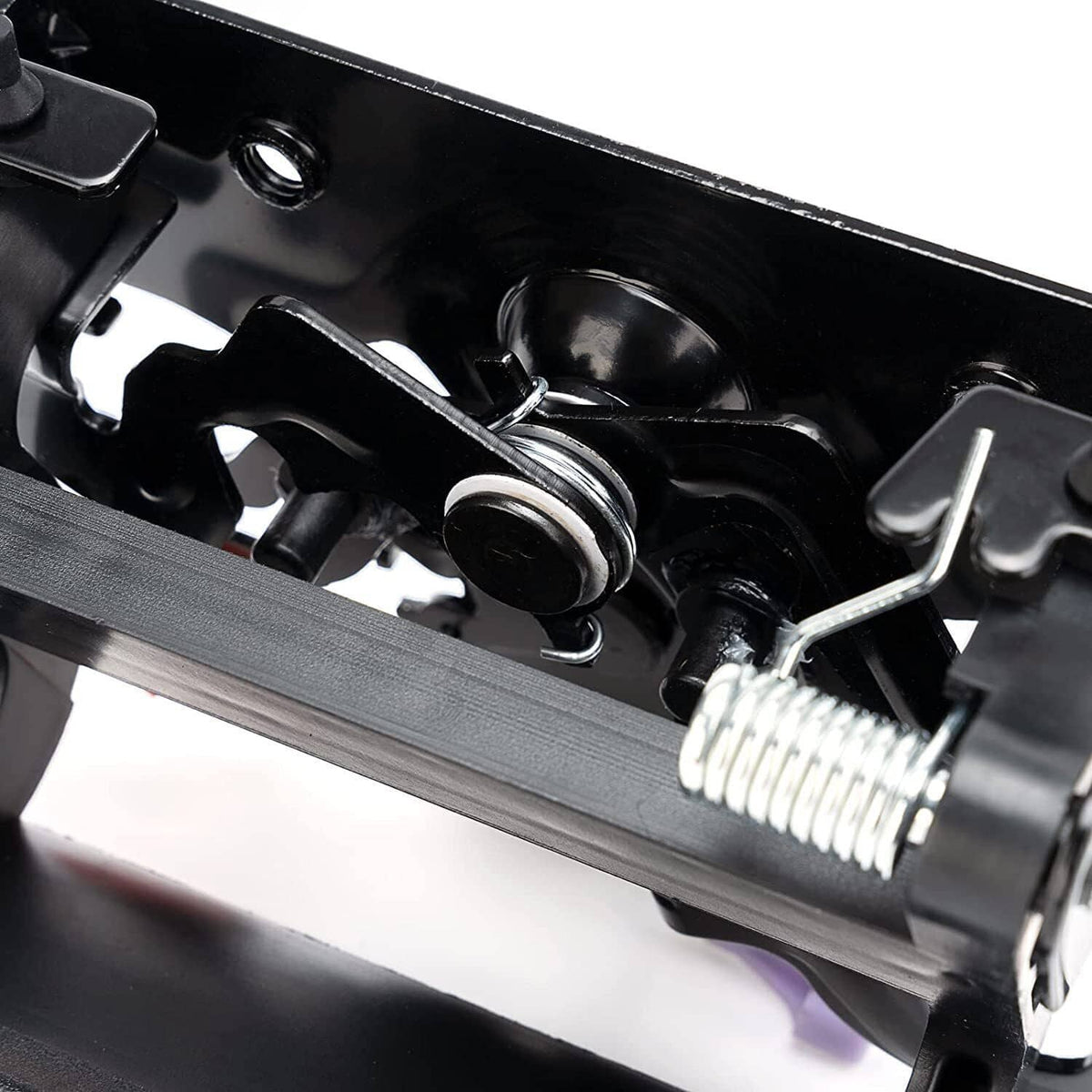 Close-up of black tailgate lock interior latch with metal spring and pins