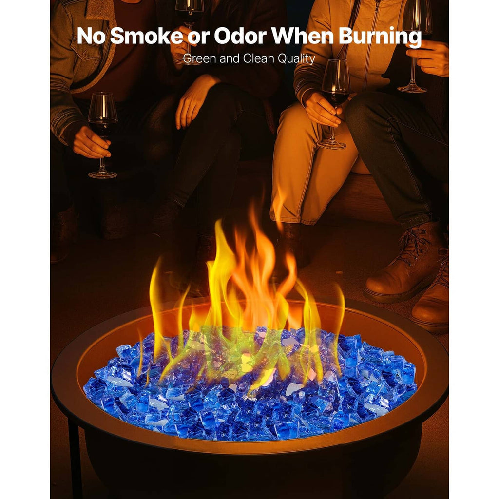 Cobalt blue glass rocks in a round fire bowl with flames rising