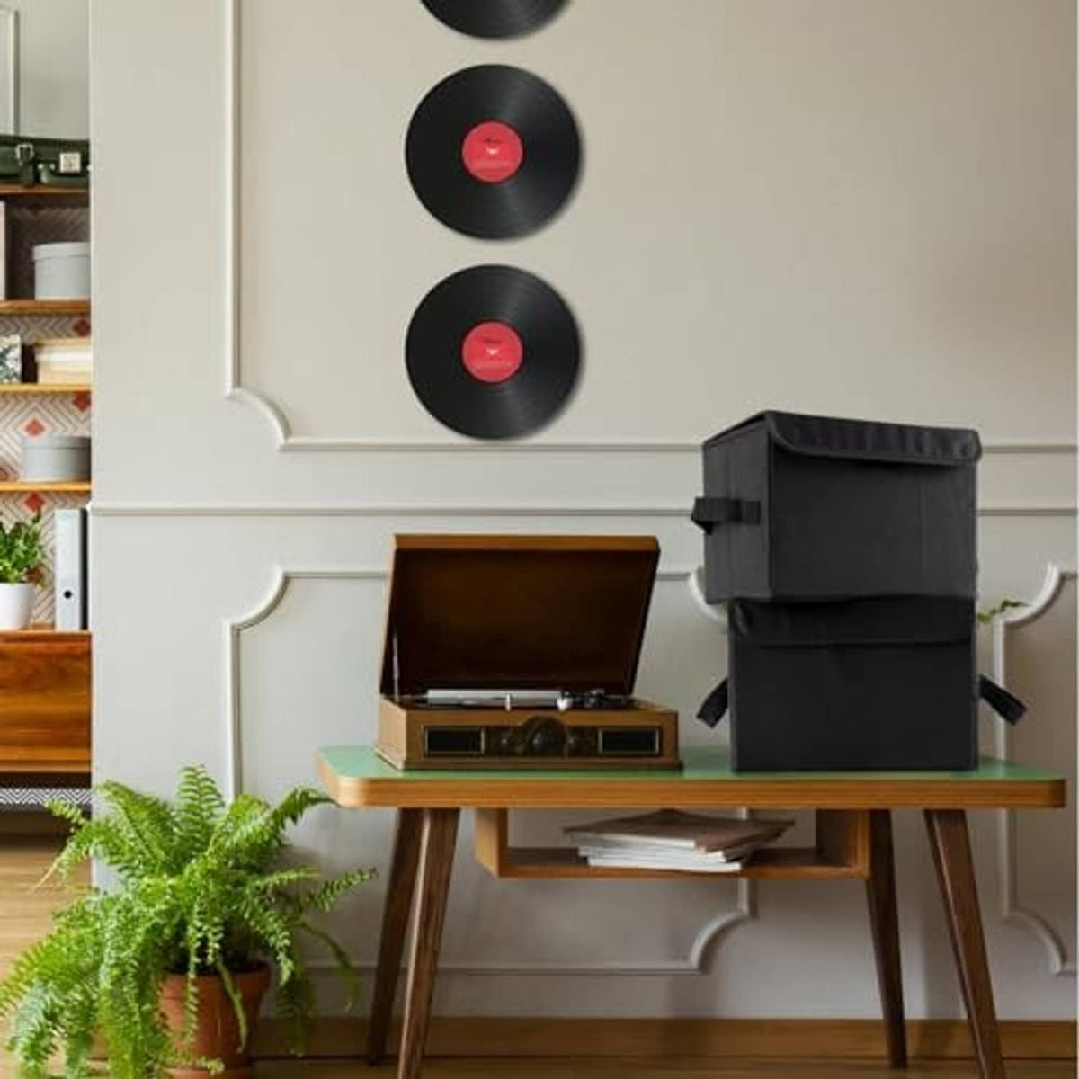 Stacked black nylon vinyl record storage boxes with foldable lids and closure straps