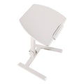 Adjustable height standing desk with rounded light tabletop and white metal support legs