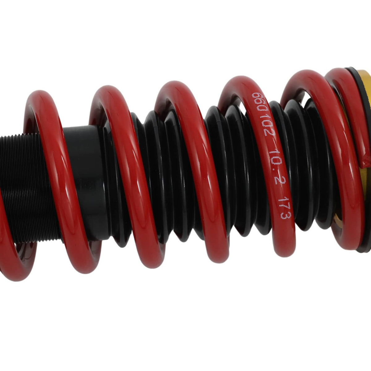 Red coilover spring coils on black threaded housing, showing spring turns