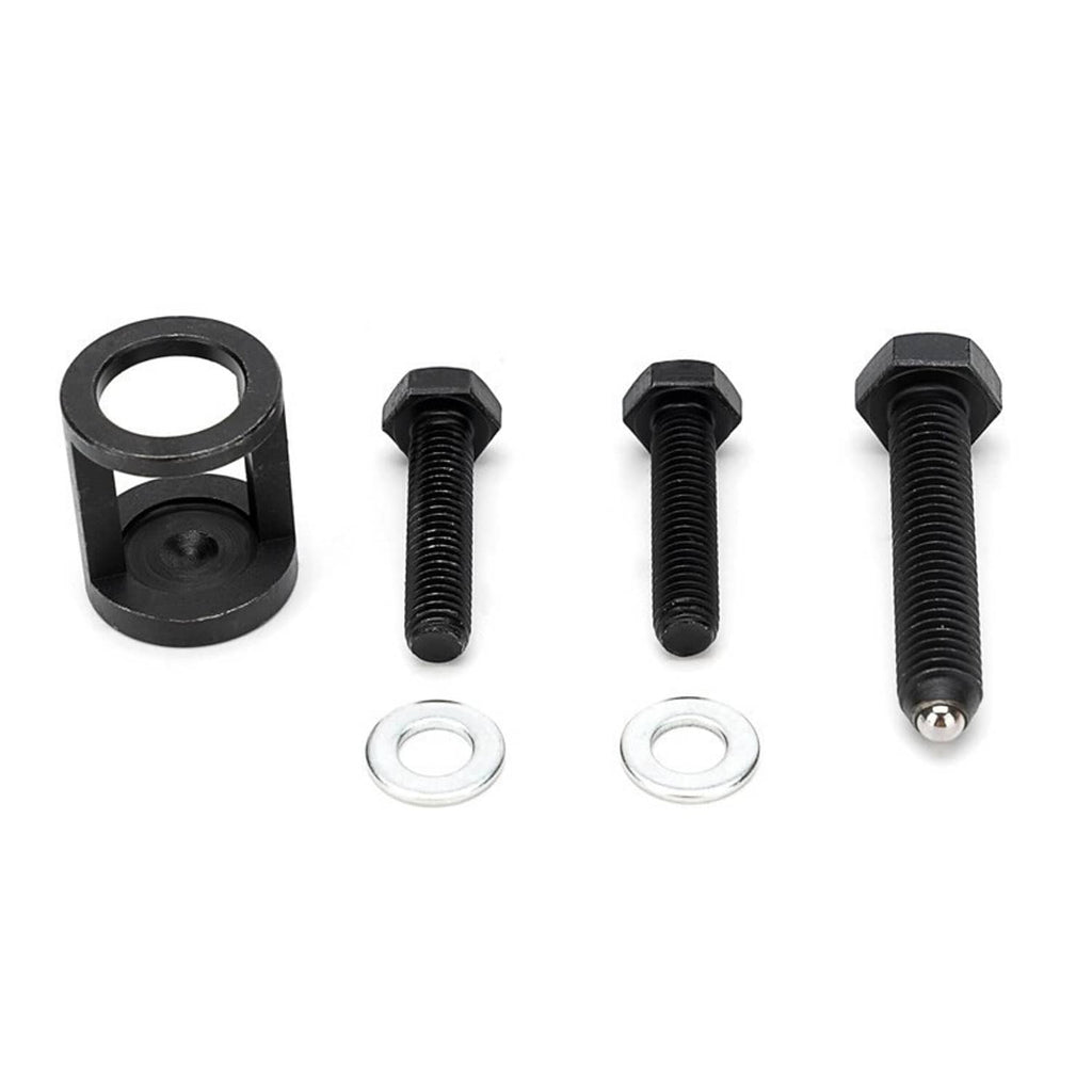 Valve spring compressor kit parts: black clamp, bolts, and two metal washers