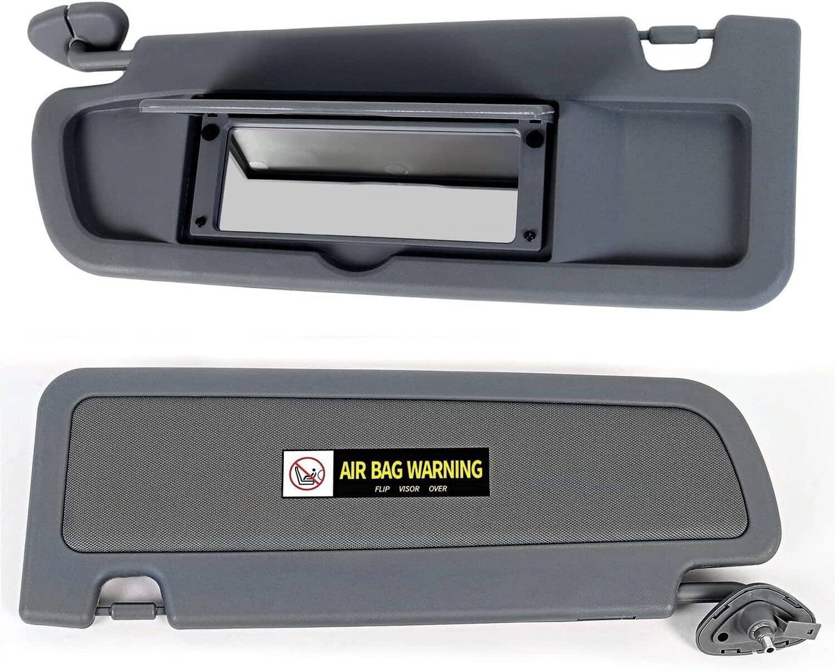 Dark gray sun visor set with rectangular mounting opening and air bag warning decals