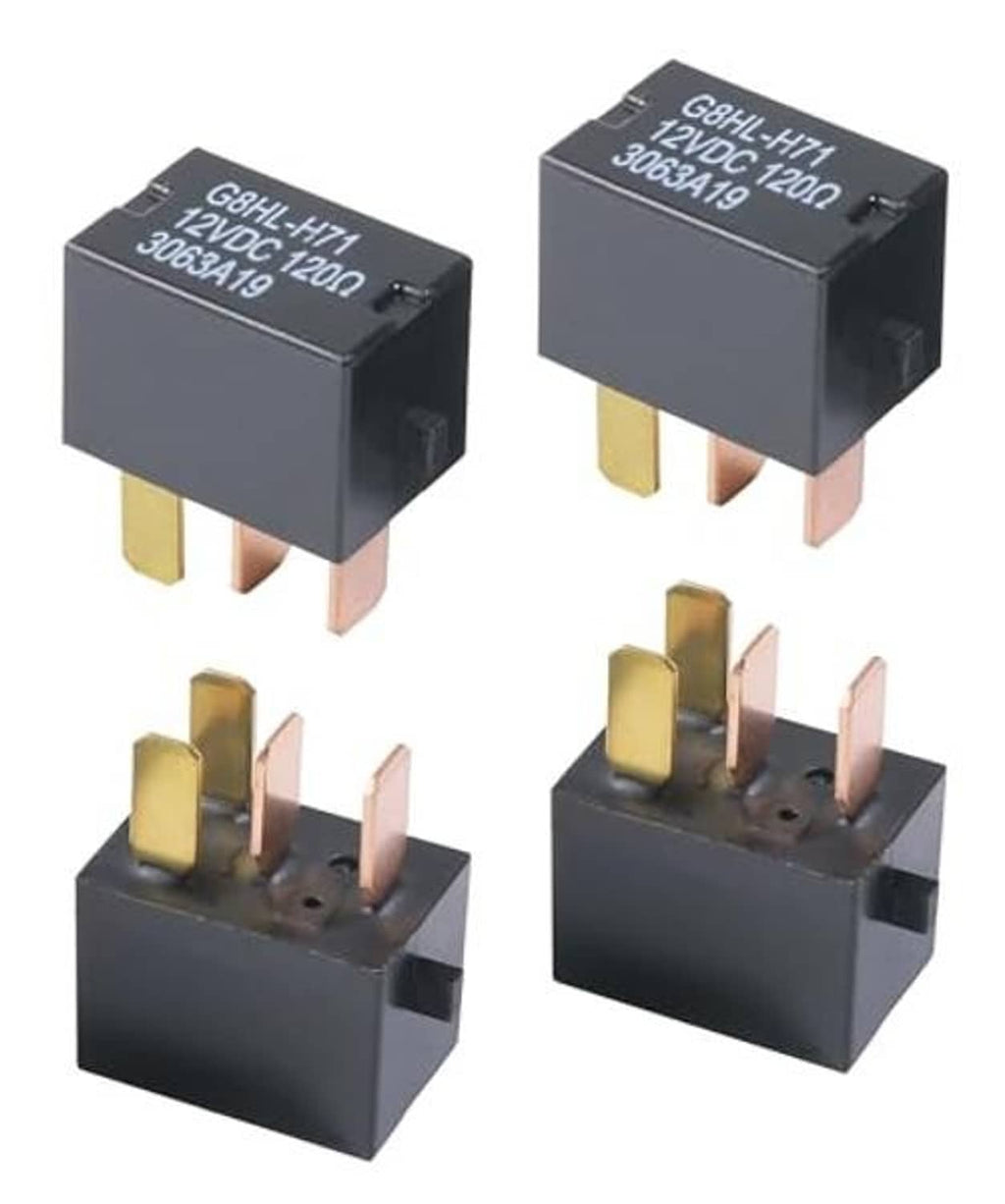 Four black 4-pin automotive relays with brass and pink blade terminals